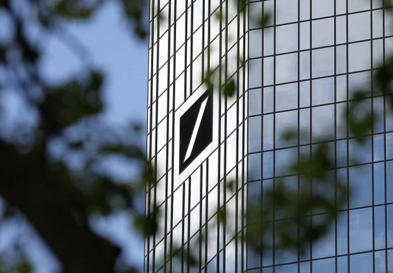 S&P cuts troubled Deutsche Bank’s rating by a notch to BBB+
