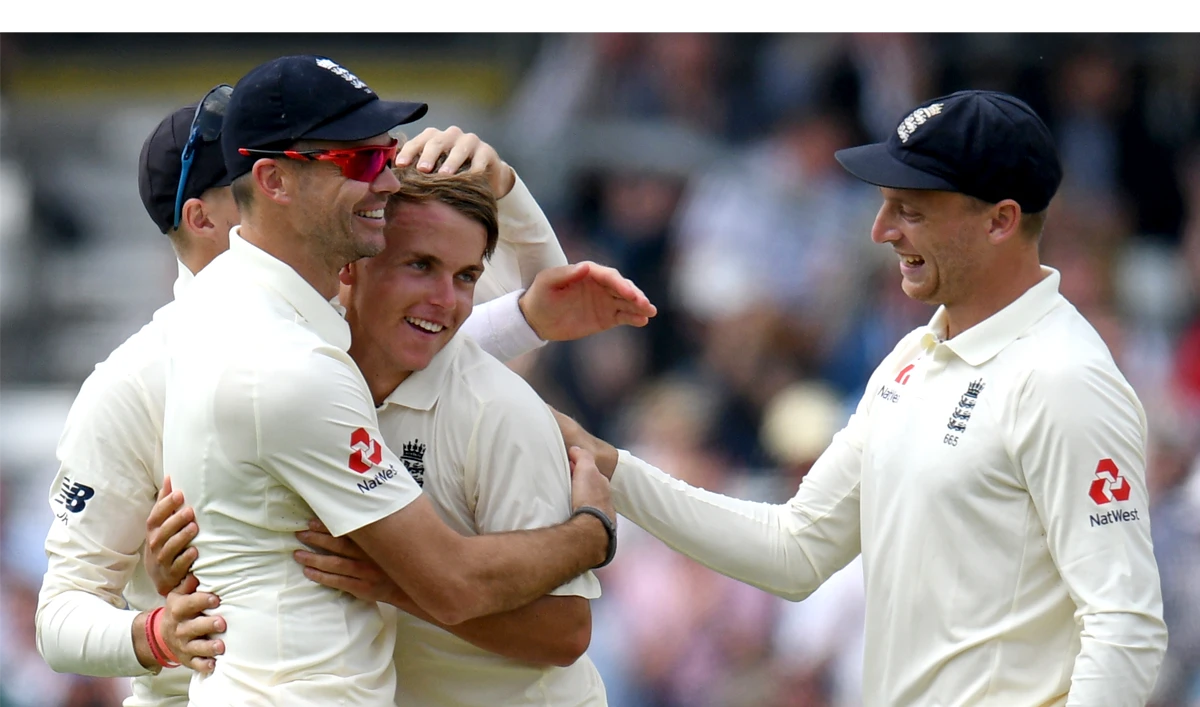 England’s Sam Curran, third left, is congratulated by his teammates after taking the wicket of Pakistan’s Shadab Khan on the first day of the second Test cricket match between England and Pakistan at Headingley cricket ground in Leeds, northern England on June 1, 2018. (AFP)