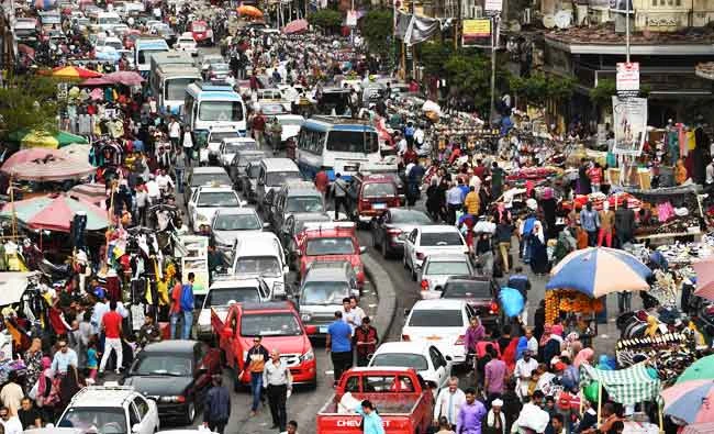 Egyptian drivers are stuck in congestion by the open air market of El Ataba in Cairo on March 23, 2018. (AFP)
