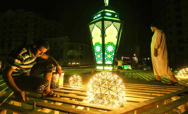 A man prepares Ramadan decorations including a lantern known as a ‘Fanous.’ AFP