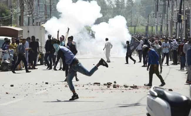Protesters clash with security forces at a funeral procession in Srinagar. AFP