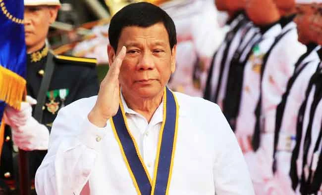 Philippine President Rodrigo Duterte salutes while passing the honour guards upon arrival during the 120th Philippine Navy anniversary in Metro Manila, Philippines, in this May 22, 2018 photo. (REUTERS)