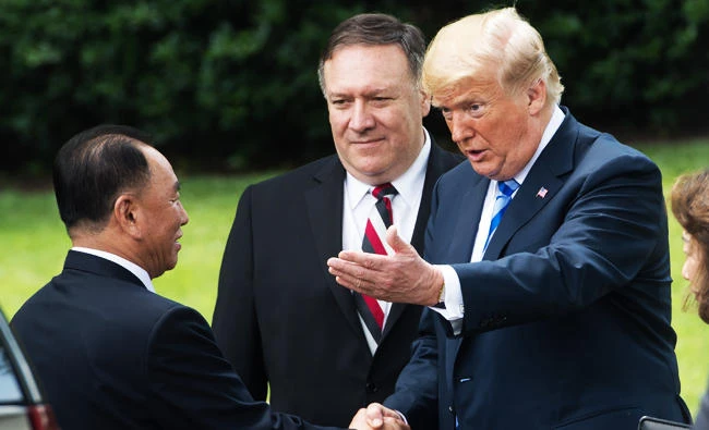 US President Donald Trump shakes hands with North Korean Kim Yong Chol (L) on the South Lawn of the White House on June 1, 2018 in Washington, DC, after a meeting, as US Secretary of State Mike Pompeo (C) looks on. (AFP)