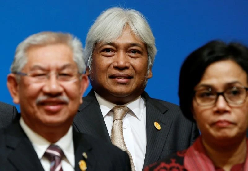 Central bank governor Muhammad Ibrahim, center, was appointed as governor in May 2016 following the retirement of long-serving governor Zeti Akhtar Aziz. (Reuters)