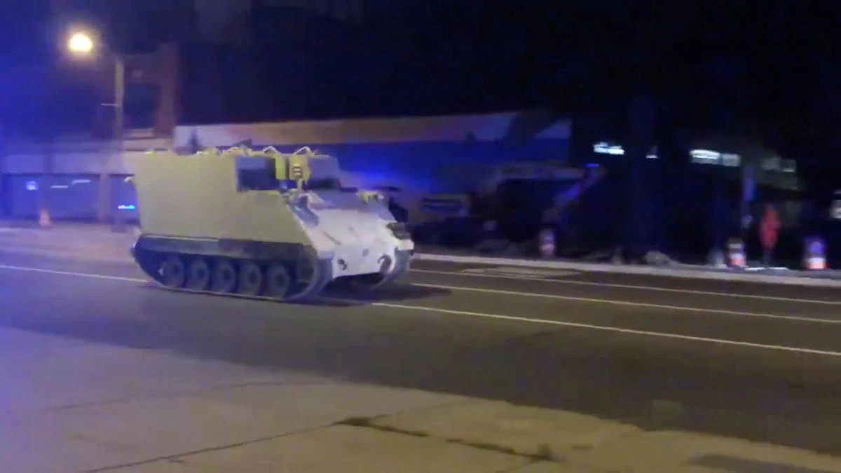 The armored personnel carrier stolen from a Virginia National Guard base drives along a street in Richmond, Virginia. (Parker Slaybaugh via Reuters)