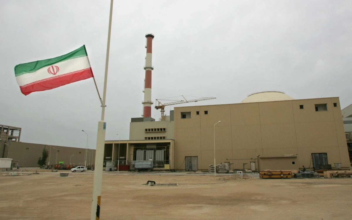 An Iranian flag is seen outside the building housing the reactor of the Bushehr nuclear power plant, in the Iranian port town of Bushehr, 1200 kms south of Tehran. (AFP)
