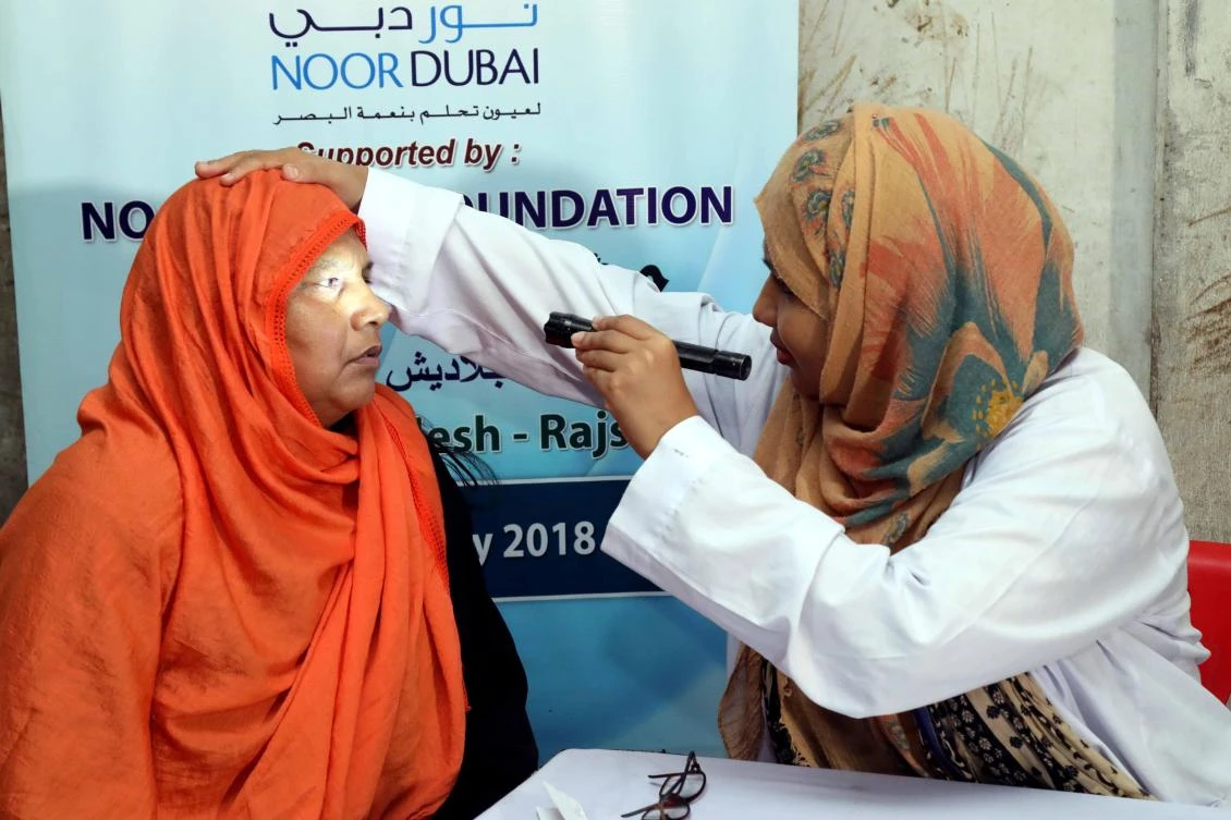 A doctor treats a patient at a camp run by Noor Dubai Foundation as part of its blindness prevention program, in Bangladesh. (Courtesy Noor Dubai)