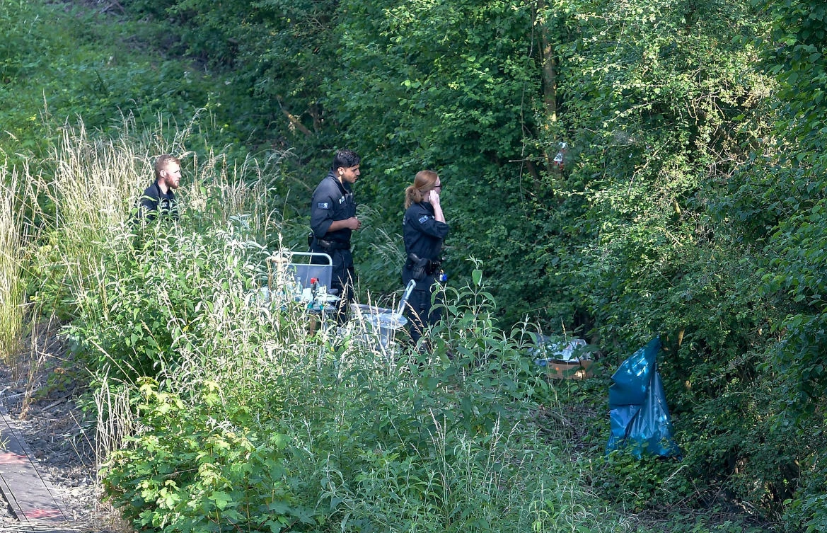German police stand at the area where they found a body near Wiesbaden-Erbenheim, Germany, June 6, 2018. (Reuters)