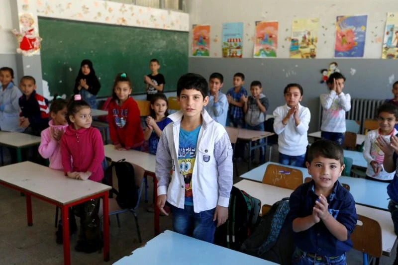 In this file photo, Syrian refugee children attend a class at a school in Mount Lebanon. (Reuters)