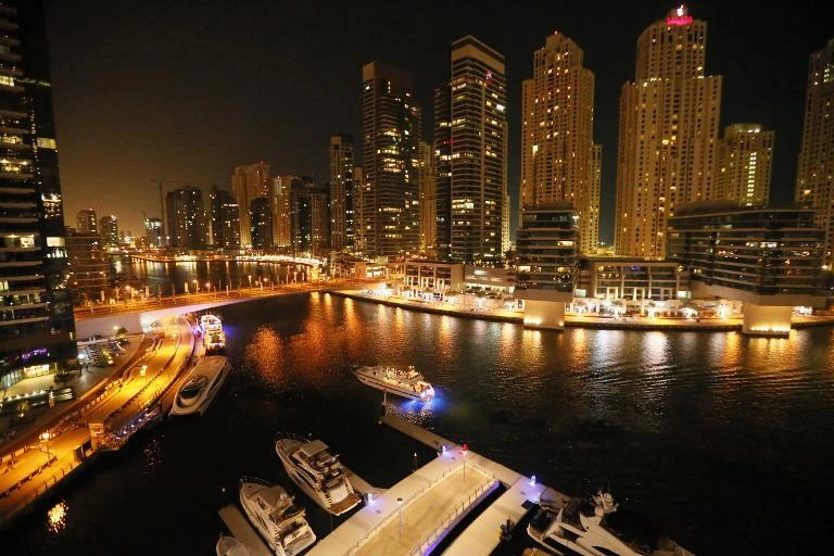 Dubai Marina by night: The UAE is the preferred market for 28 percent of GCC investors. (AFP)
