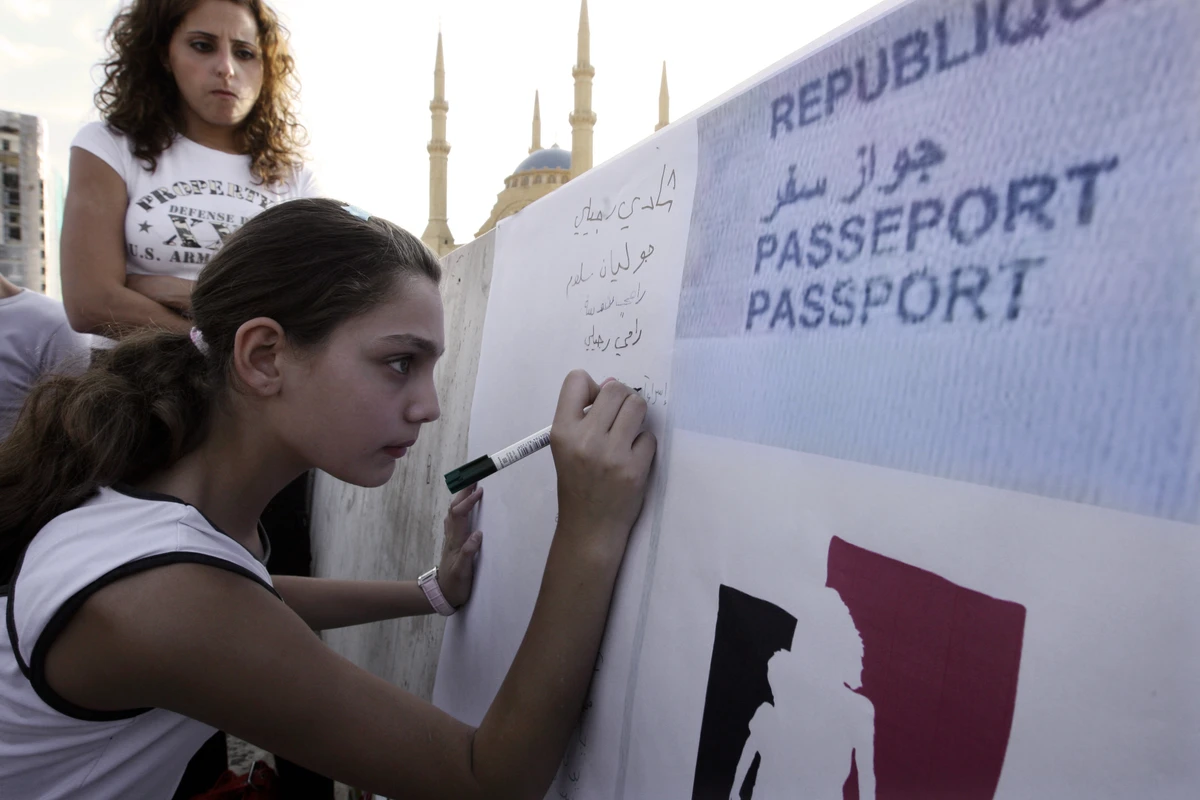 File photo showing demonstrators protesting Lebanese nationality laws banning women from passing on their nationality to children if father is a foreign national. (AFP)