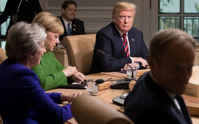 US President Donald Trump participates in a working session during the G7 Summit in Charlevoix, Quebec, Canada, June 8, 2018. (AFP)
