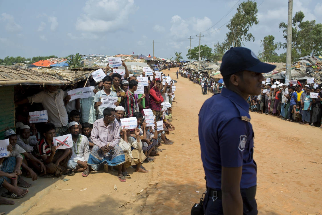 In this file photo, Rohingya refugees holing placards, await the arrival of a UN Security Council team at the Kutupalong Rohingya refugee camp in Kutupalong, Bangladesh. (AP)