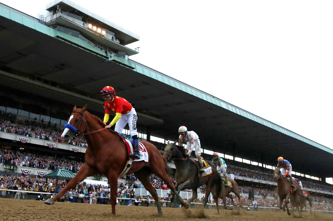 Justify crosses the line to win the 150th running of the Belmont Stakes and the Triple Crown. (Reuters)