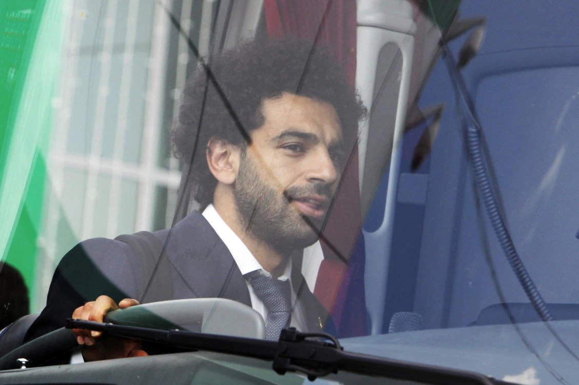 Mohamed Salah boards the team bus after arriving with the Egypt team at an airport outside Grozny, Russia. (AP)