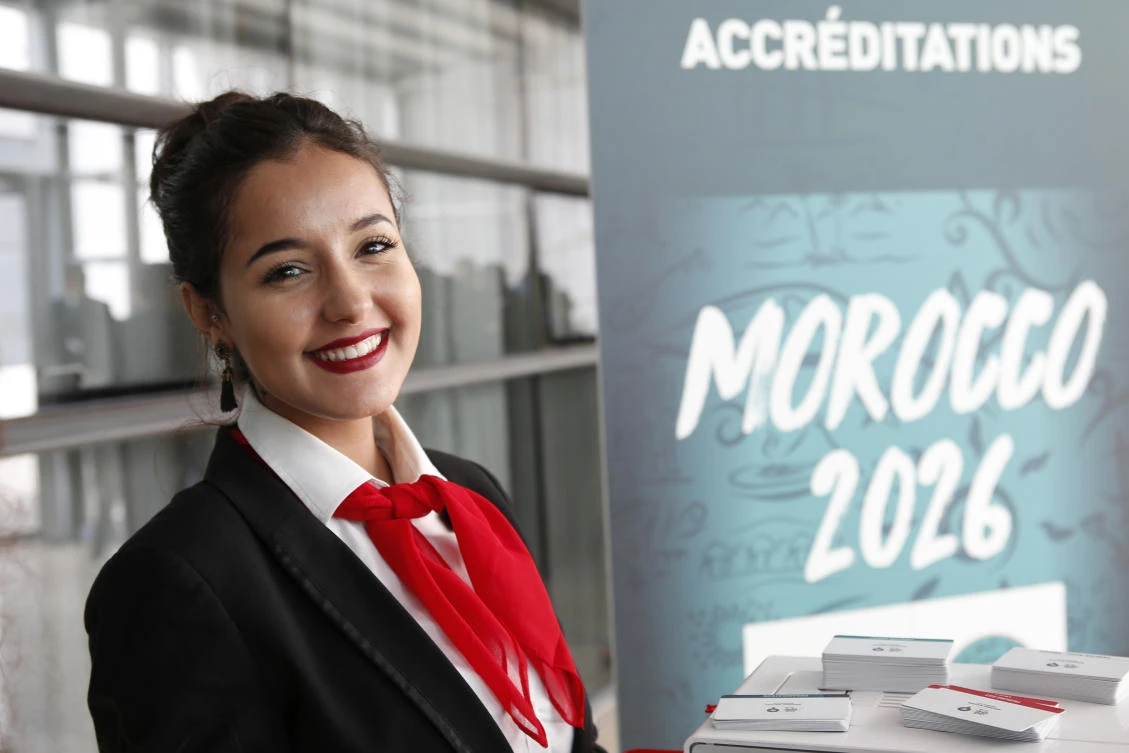 In this file photo Moroccan hostess Zainab Rchid welcomes media before a press conference held in March to promote Morocco’s bid for the 2026 soccer World Cup, in Casablanca, Morocco (Abdeljalil Bounhar/AP/File)