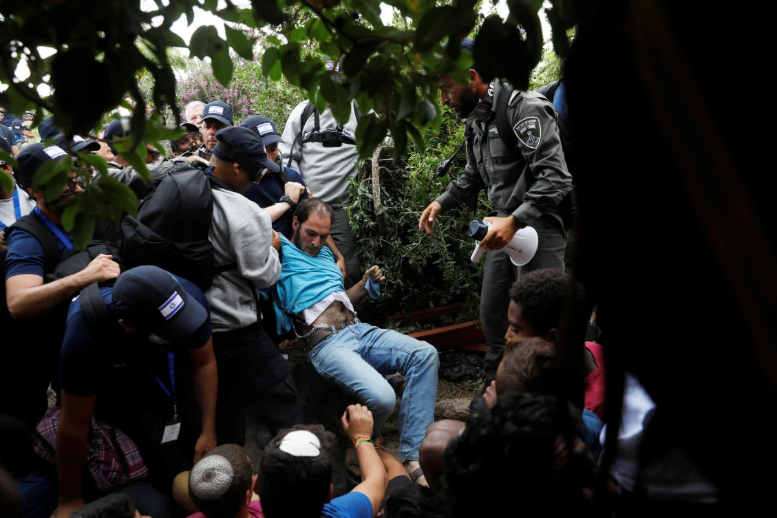 Israeli security forces remove a protester during the eviction of 15 Jewish settler families from the illegal outpost of Netiv Ha’avot in the Israeli occupied West Bank. (Reuters)