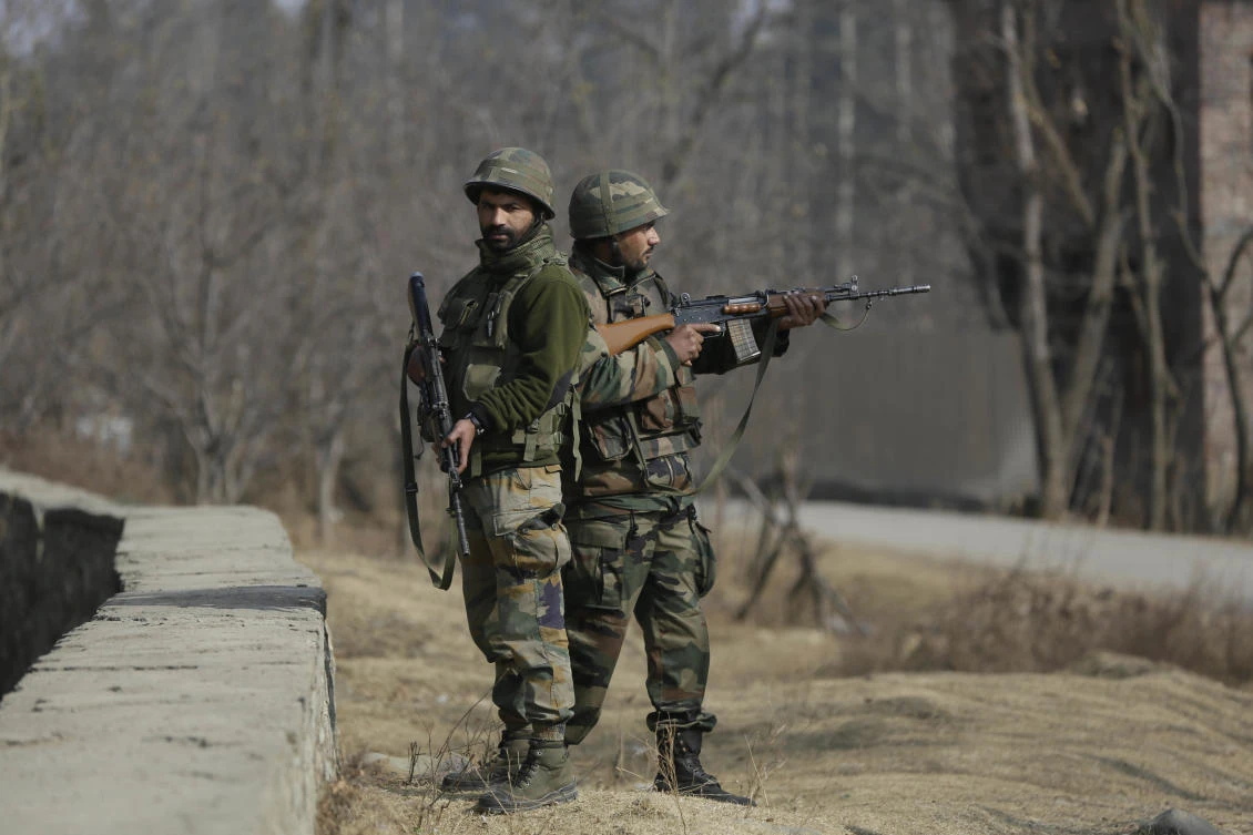 Indian army soldiers guard during a gunbattle at Pakharpore village, south of Srinagar, Indian controlled Kashmir. (File Photo: Mukhtar Khan/AP)