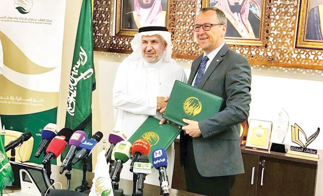 File photo showing Dr Abdullah Alrabiah the head of KSrelief with the regional head of UNICEF in MENA. (Photo courtesy KSrelief)