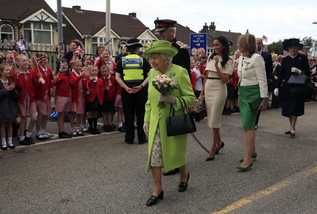 Britain’s Queen Elizabeth and Meghan cheered on first joint royal trip