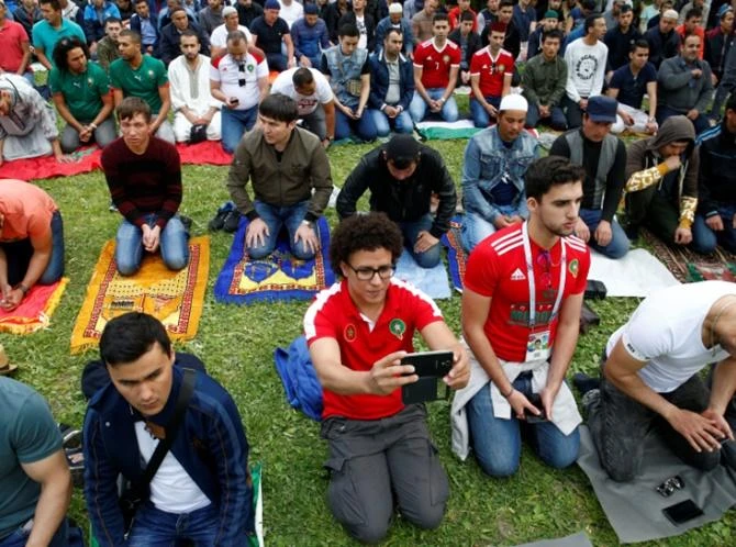 Muslims, including fans of participating World Cup teams, attend Eid Al-Fitr prayers to mark the end of the holy month of Ramadan in Saint Petersburg, Russia. (Reuters)