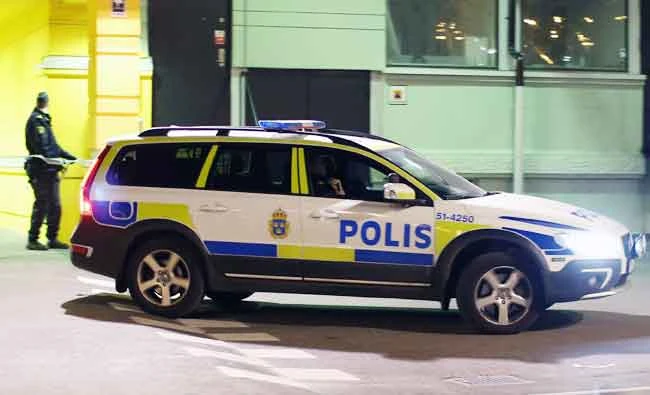A police officer examines the scene of a fatal shooting in Gothenburg, Sweden, in this file photo. (AP)