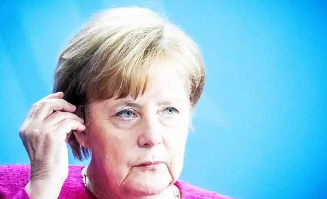 German Chancellor Angela Merkel attends a press conference with NATO chief in the Chancellery in Berlin on Friday, ahead of the alliance's summit, overshadowed by tensions between Europeans and US. (AFP)