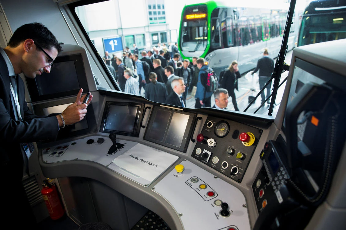 A man takes a picture of the cockpit of a Desiro City passenger train by Siemens Mobility at the InnoTrans railway technology trade fair in Berlin, September 25, 2014. (Reuters)