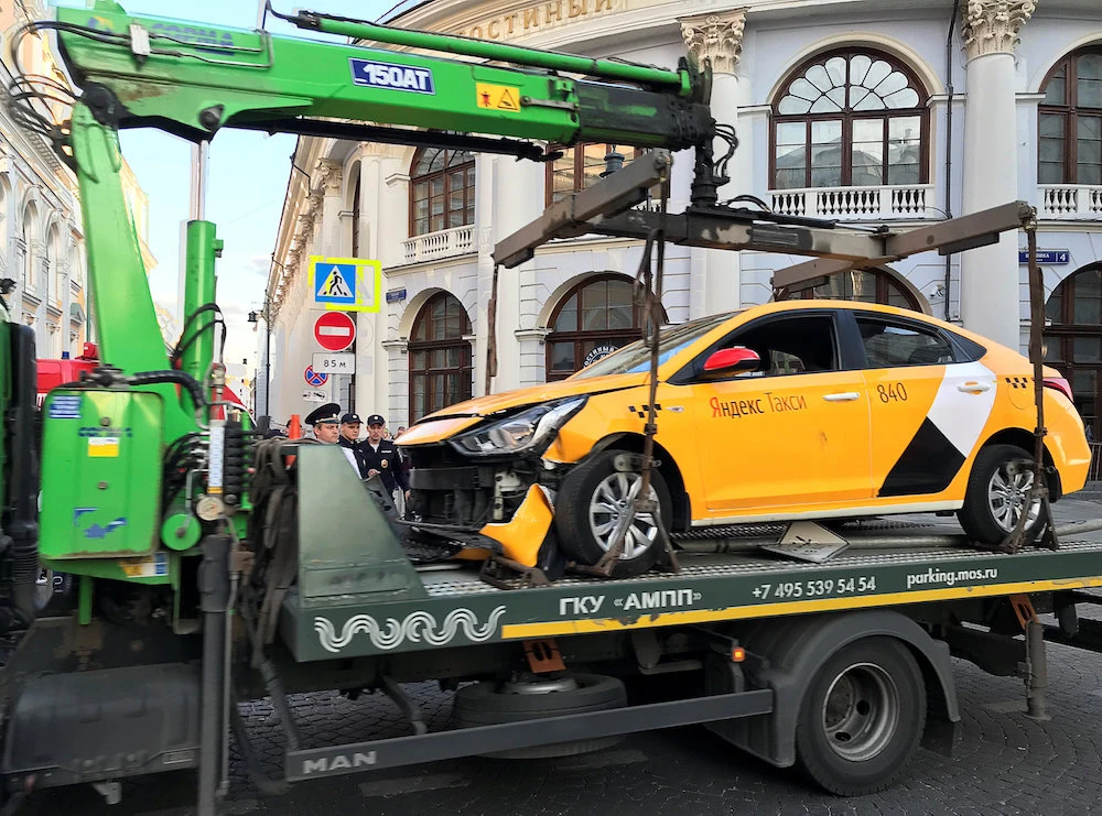 A damaged taxi, which ran into a crowd of people, is evacuated in central Moscow, Russia June 16, 2018. (Reuters)