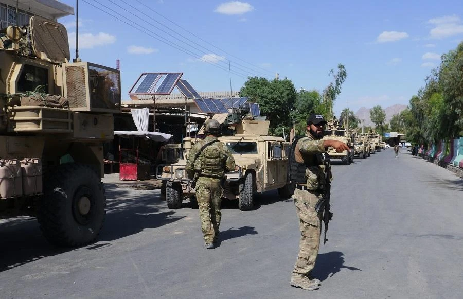 In this photograph taken on May 19, 2018, Afghan security forces patrol, after recapturing control of the city from Taliban militants, in Farah. (AFP)