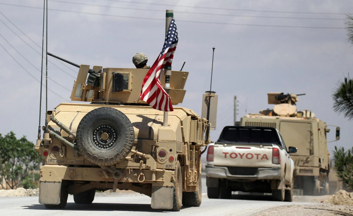 The US flag flutters on a military vehicle in Manbij countryside, Syria May 12, 2018. (Aboud Hamam/Reuters)