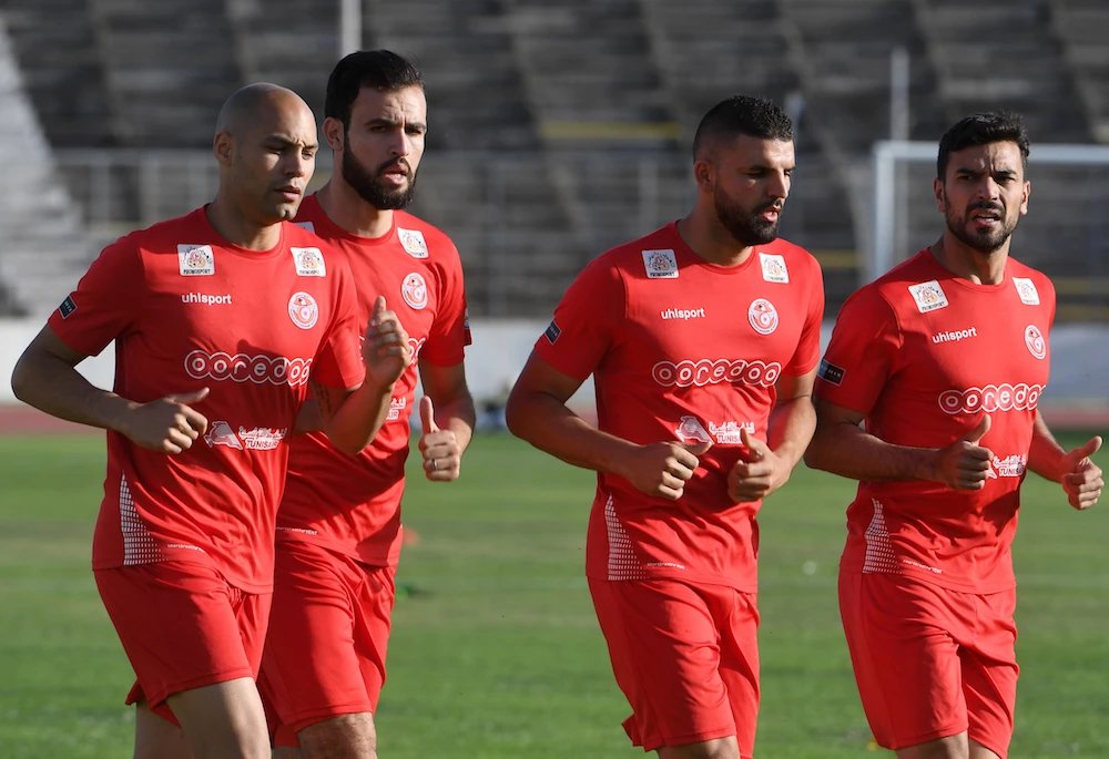 (L to R) Tunisia's defender Yohan Benalouane, defender Hamdi Nagguez, defender Syam Ben Youssef, and defender Oussama Haddadi take part in a training session at the Olympic stadium El Menzah in the Tunisian capital on June 4, 2018, as part of the team's preparation for the upcoming FIFA World Cup 2018 in Russia. (AFP)