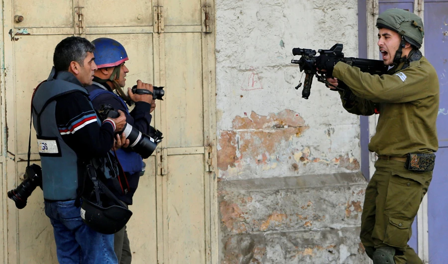 Israeli soldiers are under constant attack by Israel haters, says defense minister. (Reuters)