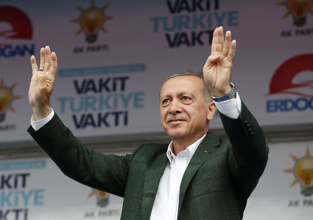 Turkey's President Recep Tayyip Erdogan, addresses supporters of his ruling Justice and Development Party (AKP) during an election rally for the upcoming June 24, elections, in Samsun, Turkey on Monday, June 18, 2018. Turkey announced its troops began patrols on the outskirts of the key northern Syrian town of Manbij following a recent deal struck with the United States and Erdogan confirmed the patrol began in his speech. (Presidency Press Service via AP, Pool)
