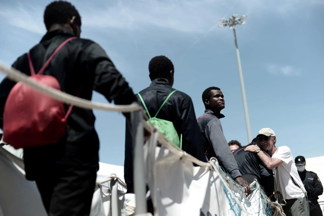 Photo showing Migrants disembark from the Aquarius rescue ship after arriving to port in Valencia, Spain, June 17, 2018. (Reuters)