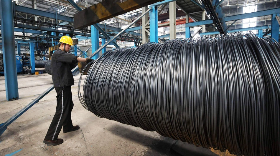 This file photo taken on May 1, 2018 shows a worker handling steel cable at a steel factory in Lianyungang, in China's eastern Jiangsu province. China on June 15, 2018 swiftly retaliated by imposing "equal" tariffs on US products following a decision by US President Donald Trump to slap duties on $50 billion of Chinese products. (AFP)