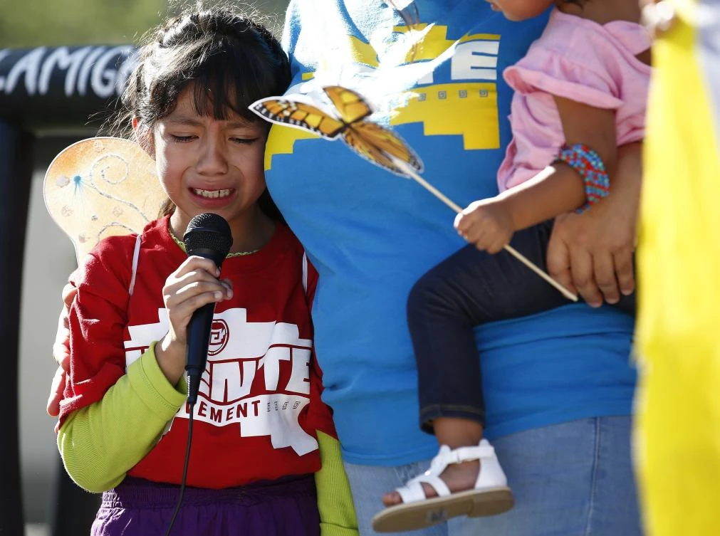 Akemi Vargas, 8, cries as she talks about being separated from her father during an immigration family separation protest in front of the Sandra Day O’Connor US District Court building on June 18, 2018, in Phoenix, US. (AP Photo/Ross D. Franklin)
