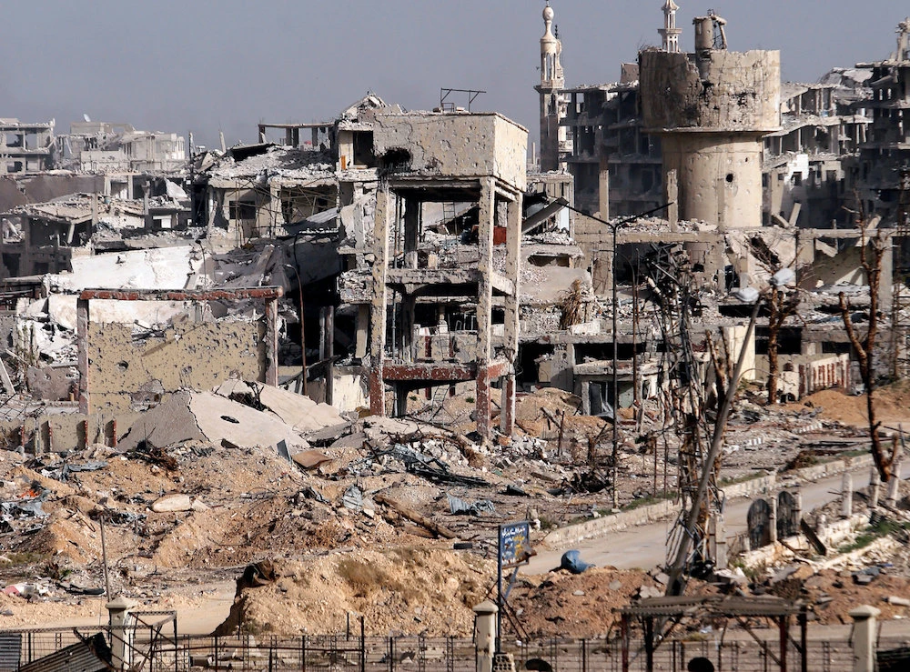 File photo showing damaged buildings in Jobar as seen from Harasta highway, Damascus, Syria, March 27, 2018. (Reuters)