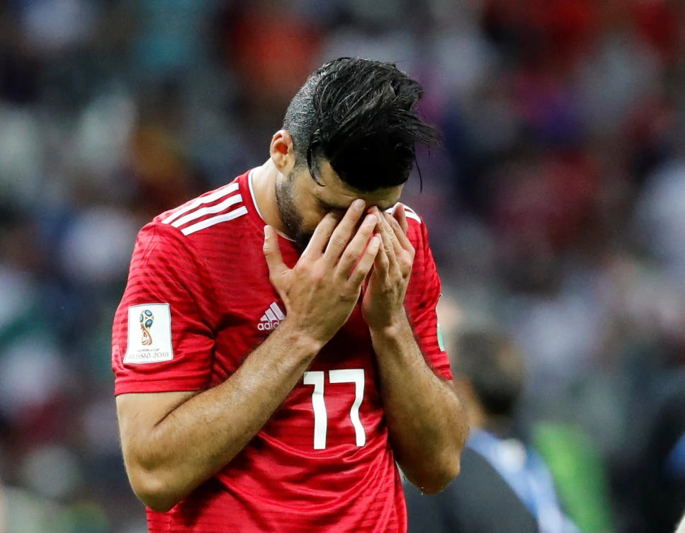 Iran's Mehdi Taremi looks dejected after the match. (REUTERS/Toru Hanai)