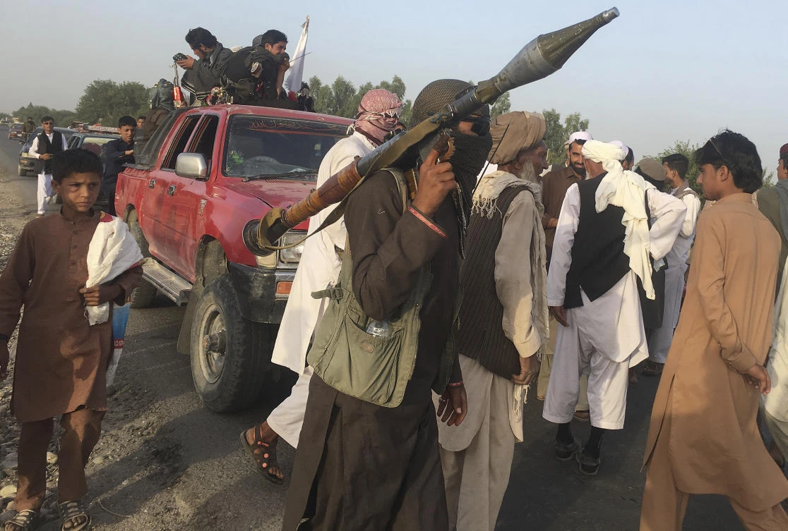 Taliban fighters gather in Surkhroad district of Nangarhar province, east of Kabul on Saturday, June 16. The Taliban resumed their attacks after a three-day ceasefire last weekend coinciding with the Muslim Eid Al-Fitr holiday. (AP)