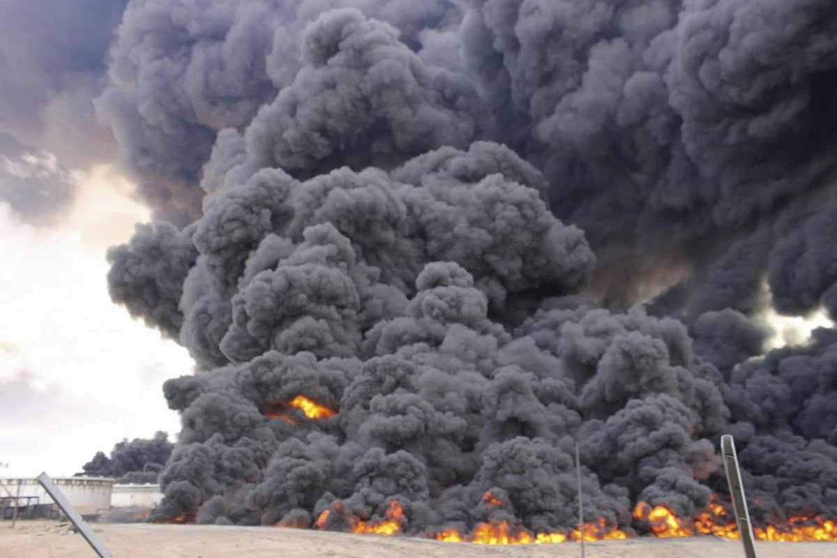 Third oil storage tank at Libya's Ras Lanuf oil terminal set alight during clashes