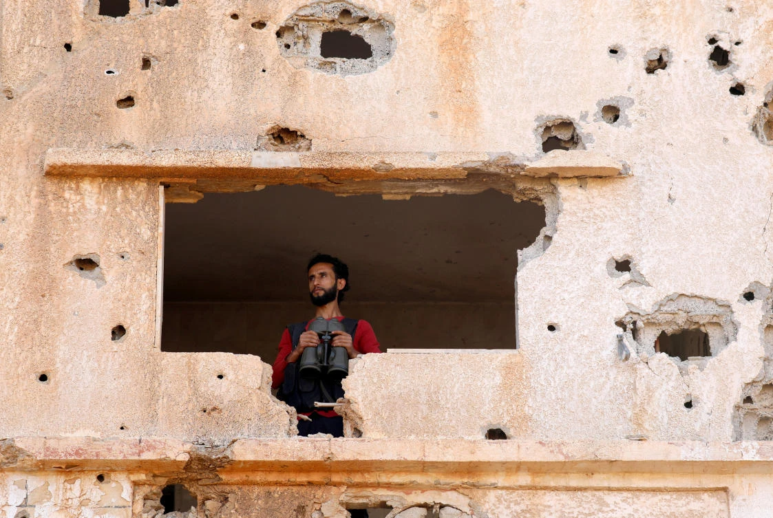 Above, a fighter from the Free Syrian Army in the Yadouda area of Daraa. (Reuters)