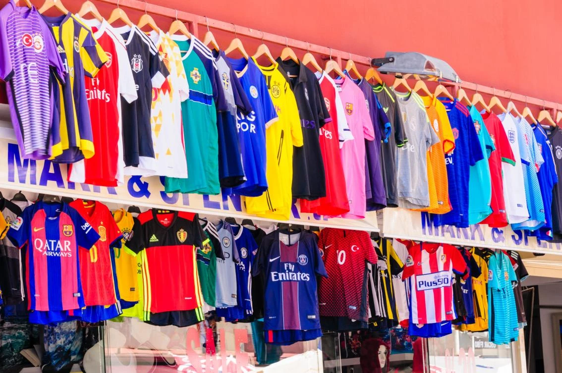 Stores in Dubai's Karama district sell counterfeit shirts for a fraction of their official retail price.