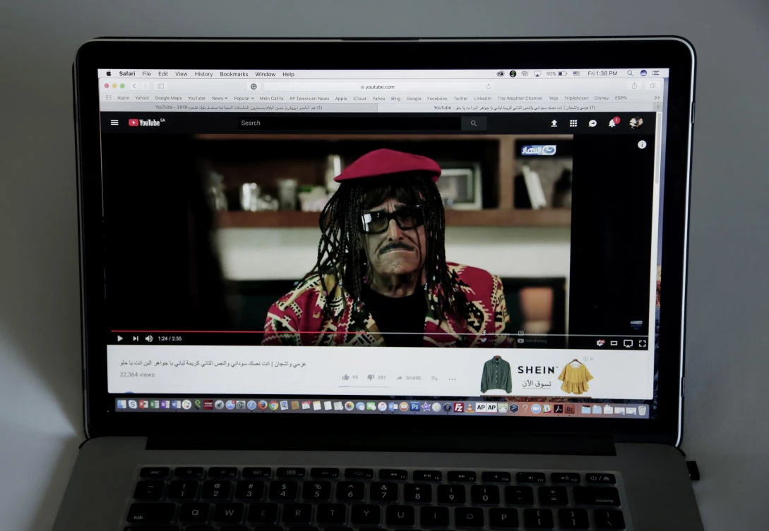 This June 22, 2018 photo, comedian Samir Ghanem wears a wig with braids on an Egyptian show called “Azmi We Ashgan,” which aired on the privately owned Al-Nahar channel, is seen on a laptop (AP Photo)