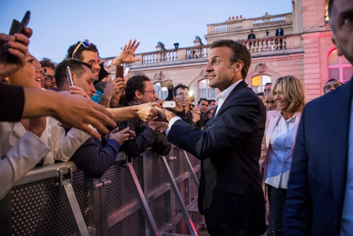 French President Emmanuel Macron and his wife Brigitte greet guests during the ‘Fete de la Musique’, the music day celebration, in the courtyard of the Elysee Palace, in Paris, France, June 21, 2018. (Reuters)