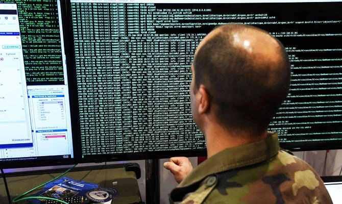 A member of the military specialised in cyber defense works on servers in Lille on January 23, 2018 during the 10th International Cybersecurity Forum. (AFP)