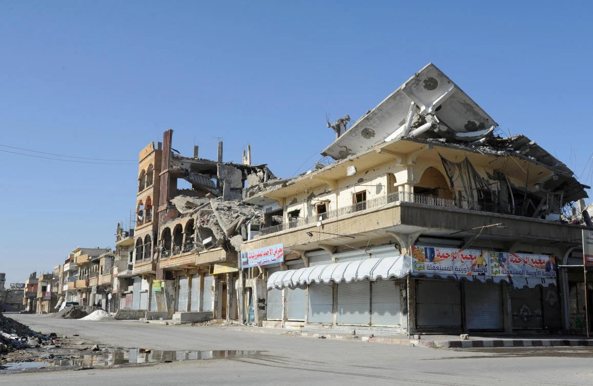 Closed shops are pictured along an empty street in Raqqa, Syria June 24, 2018. (Reuters)