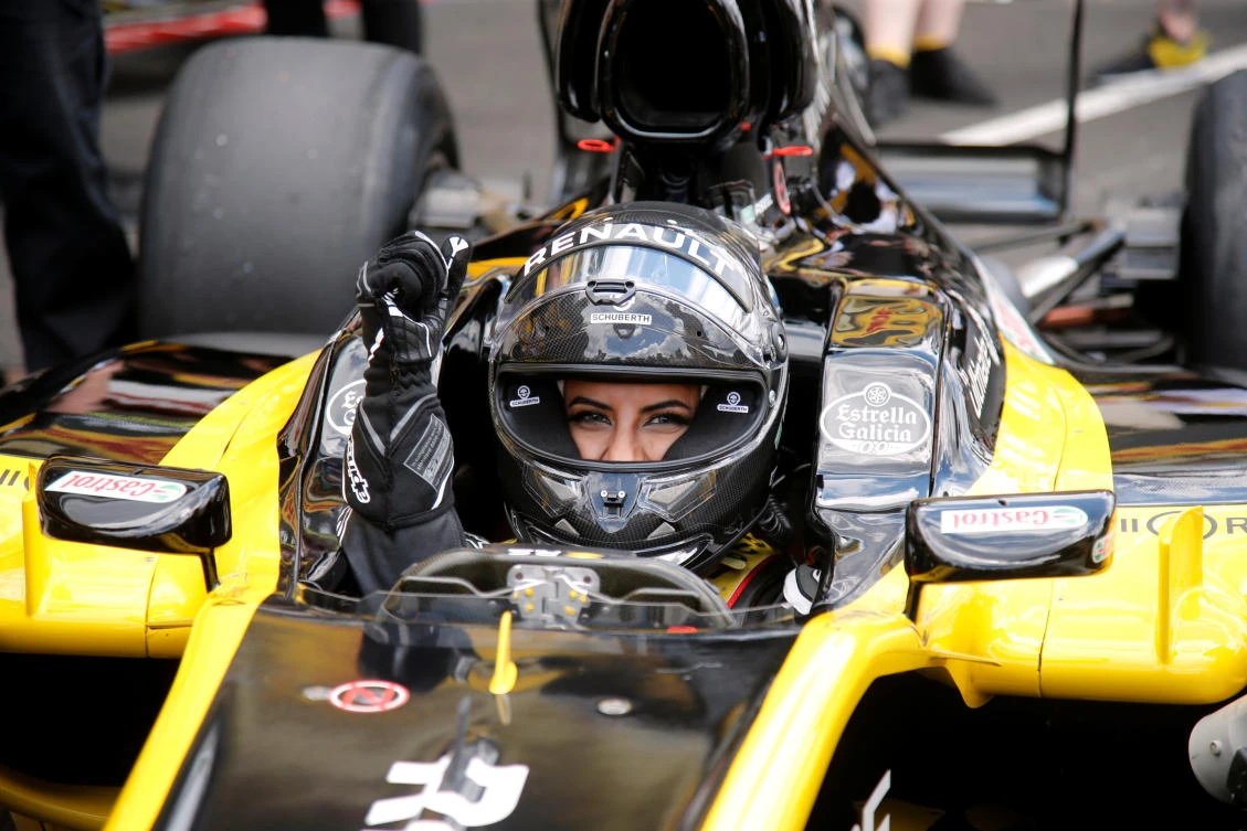 Aseel Al-Hamad of Saudia Arabia poses for a photo before driving a Lotus Renault E20 Formula One car during a parade before the race (REUTERS/Jean-Paul Pelissier)