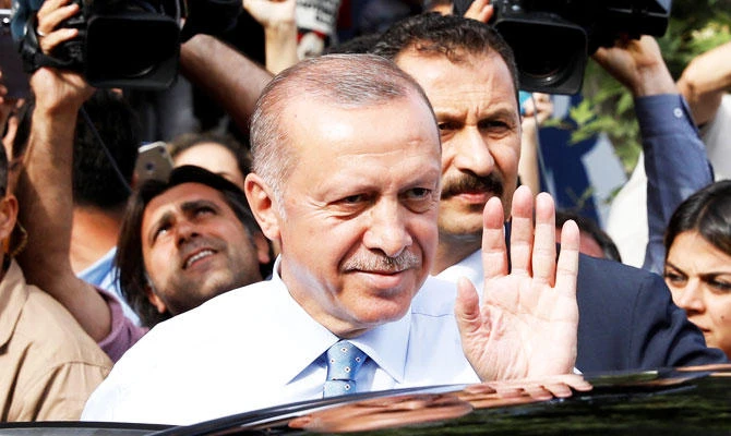 Turkish President Tayyip Erdogan waves to supporters as he leaves his residence in Istanbul, Turkey on Sunday. (REUTERS)