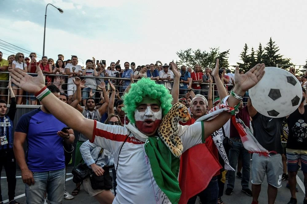 Fans of Iran cheer in front of the hotel where the Portugal team in the city of Saransk on June 24, 2018, during the Russia 2018 World Cup football tournament. (AFP)